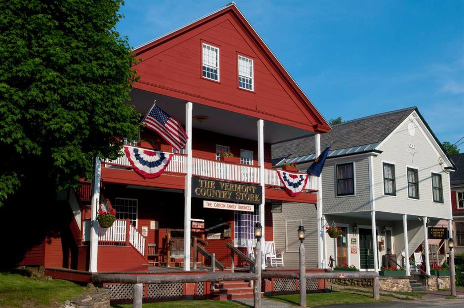 The red Vermont Country Store in Weston, flags and bunting on the porch, on Route 100